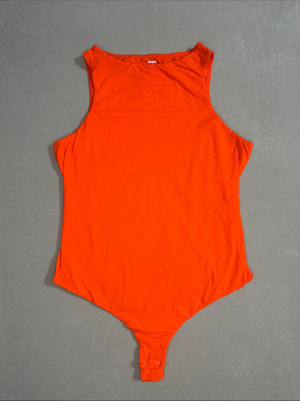 SKIMS Kids Orange Stretch Bodysuit